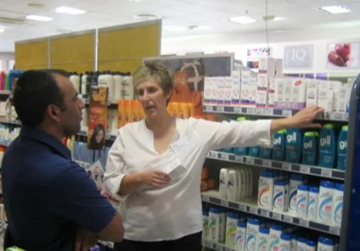 Product demonstration in a retail aisle