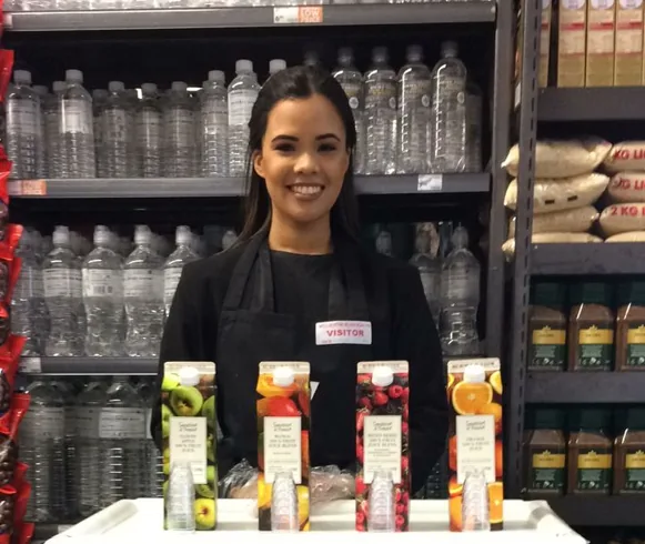 Beverage sampling promoter at a branded table