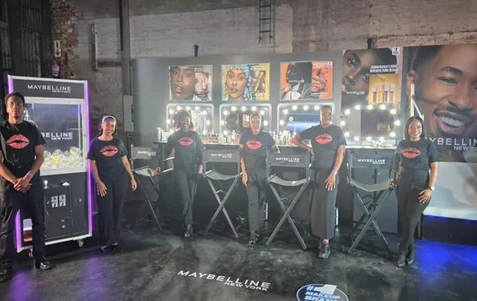 Maybelline makeup stations staffed by artists