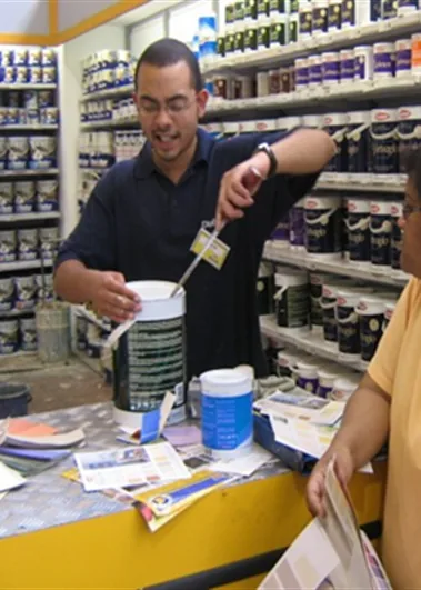 Paint brand representative demonstrating product